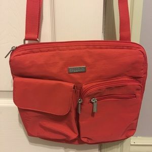 Coral color Baggallini crossbody/shoulder bag.
